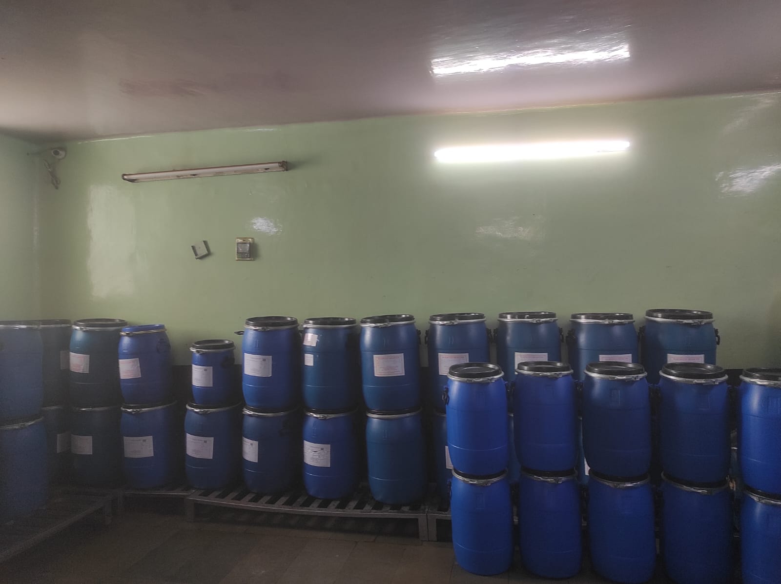 Sealed drums stacked on pallets in the finished goods store
