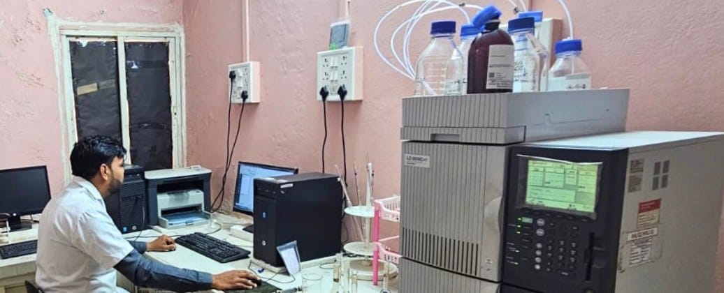 A chemist operating a high performance liquid chromatography system